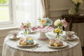 Floral-patterned cake stand on a light gray background