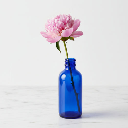 Blue glass bottle on a white background