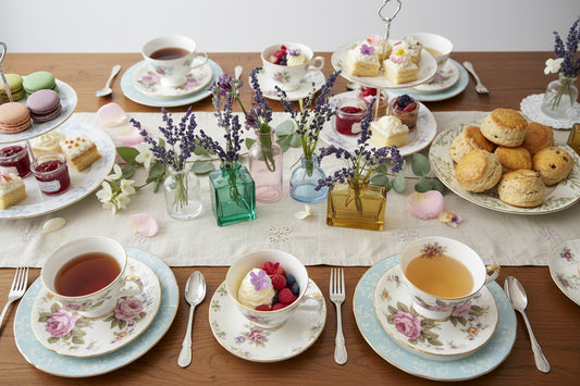 Set of colorful glass vases with lavender on a white background